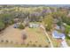 Expansive aerial shot showcasing a home nestled within a lush, tree-filled landscape at 1312 Milstead Ave, Conyers, GA 30012