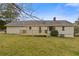 The back of the house and a well-maintained deck surrounded by a lush, green lawn at 1312 Milstead Ave, Conyers, GA 30012