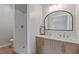 Modern bathroom with double sink vanity, walk-in shower, and updated fixtures at 1312 Milstead Ave, Conyers, GA 30012