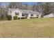 Charming home with meticulous front yard landscaping at 1312 Milstead Ave, Conyers, GA 30012