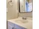 Bright bathroom features a white vanity with a sleek mirror and modern fixtures at 1700 Conductor Ln, Conyers, GA 30013