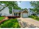 Charming single-Gathering home featuring a well-manicured lawn, stone accents, and a cozy front porch at 2305 Keenland Ct, Cumming, GA 30040