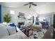 Bright living room boasts vaulted ceilings, fireplace, and seamless flow to the dining area at 2305 Keenland Ct, Cumming, GA 30040