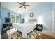 Serene bedroom with a large window, soft lighting, and comfortable furnishings at 2305 Keenland Ct, Cumming, GA 30040