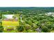 Aerial perspective, highlighting the home's expansive, tree-lined surroundings in a suburban community at 2696 Eldorado Pl, Snellville, GA 30078