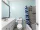 Bright bathroom features a tub with shower and modern fixtures at 2696 Eldorado Pl, Snellville, GA 30078