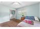 Comfortable bedroom features hardwood floors and natural light at 2696 Eldorado Pl, Snellville, GA 30078