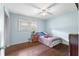 Comfortable bedroom features hardwood floors and natural light at 2696 Eldorado Pl, Snellville, GA 30078