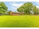 Spacious front yard featuring a well-maintained lawn and a quaint, single-story brick house at 2696 Eldorado Pl, Snellville, GA 30078