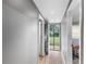 Hallway with lots of light and access to backyard at 2696 Eldorado Pl, Snellville, GA 30078