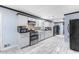 Modern kitchen with stainless steel appliances, tile backsplash, and sleek countertops at 2696 Eldorado Pl, Snellville, GA 30078