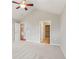 Spacious bedroom with neutral carpeting and view of a walk-in closet at 6107 Malloway Ct # B-6107, Cumming, GA 30041
