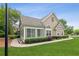Well-maintained home with a green lawn, detailed trim, and stone accents at 6107 Malloway Ct # B-6107, Cumming, GA 30041