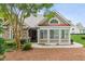 Charming home exterior featuring stone accents, large windows, and lush landscaping at 6107 Malloway Ct # B-6107, Cumming, GA 30041