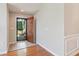 Inviting foyer with wood floors and an open door at 6107 Malloway Ct # B-6107, Cumming, GA 30041