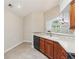 Eat-in kitchen features a breakfast bar, tile backsplash, and ample counter space at 6107 Malloway Ct # B-6107, Cumming, GA 30041