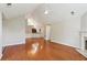Spacious living room with hardwood floors, ceiling fan, and fireplace at 6107 Malloway Ct # B-6107, Cumming, GA 30041