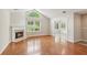 Bright living room with fireplace, lots of natural light, and hardwood floors at 6107 Malloway Ct # B-6107, Cumming, GA 30041