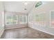 Inviting sunroom with an abundance of natural light streaming through large windows at 6107 Malloway Ct # B-6107, Cumming, GA 30041