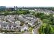 Aerial view of modern townhomes surrounded by mature trees, showing its location in a wooded area at 6613 Encore Blvd, Atlanta, GA 30328