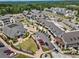 Dynamic aerial view of a vibrant mixed-use development showcasing upscale townhomes, retail spaces, and convenient parking at 6613 Encore Blvd, Atlanta, GA 30328