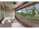 Relaxing outdoor balcony area with comfortable seating and a scenic view of lush greenery at 6613 Encore Blvd, Atlanta, GA 30328