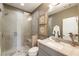 Modern bathroom with a glass-enclosed shower, elegant vanity, and neutral color scheme at 6613 Encore Blvd, Atlanta, GA 30328