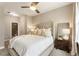 Comfortable bedroom with a large bed, stylish nightstands, and ample closet space at 6613 Encore Blvd, Atlanta, GA 30328
