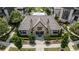Stately clubhouse with stone accents, twin chimneys, and lush landscaping, perfect for community events and gatherings at 6613 Encore Blvd, Atlanta, GA 30328