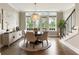 Elegant dining room with stylish chandelier, natural light, hardwood floors, and staircase access, perfect for Gathering gatherings at 6613 Encore Blvd, Atlanta, GA 30328