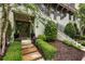 Landscaped entrance featuring stone walkway and garden leading to a stylish front door at 6613 Encore Blvd, Atlanta, GA 30328