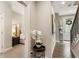 Elegant hallway with hardwood floors, leading to the bedroom and front door at 6613 Encore Blvd, Atlanta, GA 30328