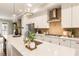 Bright kitchen features a white island, modern appliances, decorative backsplash, and an open layout, perfect for entertaining at 6613 Encore Blvd, Atlanta, GA 30328
