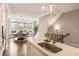 Open kitchen and dining area featuring an island, modern lighting, stainless steel appliances, and beautiful hardwood flooring at 6613 Encore Blvd, Atlanta, GA 30328