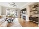 Comfortable living room with fireplace, TV, and natural light at 6613 Encore Blvd, Atlanta, GA 30328