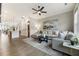 Open living area with view of the dining and living room and comfortable seating with large windows at 6613 Encore Blvd, Atlanta, GA 30328