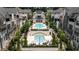 Beautifully landscaped community pool area with upper and lower pools, lounge chairs, and attractive architectural details at 6613 Encore Blvd, Atlanta, GA 30328