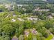 A neighborhood surrounded by mature trees and lush landscaping at 7250 Hunters Branch Dr, Atlanta, GA 30328