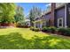 Large, lush backyard showcases a well-maintained lawn and mature landscaping at 7250 Hunters Branch Dr, Atlanta, GA 30328