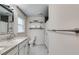 Bright bathroom featuring granite counters, modern fixtures, and tiled floors at 7250 Hunters Branch Dr, Atlanta, GA 30328