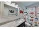 Cheerful bathroom with playful construction theme, decorative accents, and functional design at 7250 Hunters Branch Dr, Atlanta, GA 30328