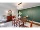 Elegant dining room with a dark wood table, chairs, buffet, and stylish light fixture at 7250 Hunters Branch Dr, Atlanta, GA 30328
