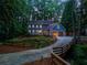 Charming home with well-manicured front yard, inviting entrance, and curved driveway at 7250 Hunters Branch Dr, Atlanta, GA 30328
