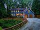 Beautiful two-story home with a charming exterior, featuring an attached two-car garage and inviting curb appeal at 7250 Hunters Branch Dr, Atlanta, GA 30328