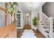 Bright entryway featuring hardwood floors, a staircase, and a view into the home's interior at 7250 Hunters Branch Dr, Atlanta, GA 30328