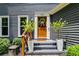 Inviting front entrance with a decorative wreath on the door, potted plants, and stylish details at 7250 Hunters Branch Dr, Atlanta, GA 30328