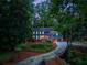 The home features a two-car garage and a unique fenced in gully at 7250 Hunters Branch Dr, Atlanta, GA 30328