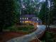 A charming home featuring a two-car garage with a long, winding driveway at 7250 Hunters Branch Dr, Atlanta, GA 30328