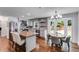 Spacious kitchen featuring stainless appliances, granite counters, and an eat-in dining area at 7250 Hunters Branch Dr, Atlanta, GA 30328