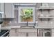 Close up of the kitchen sink with stainless appliances and granite countertops at 7250 Hunters Branch Dr, Atlanta, GA 30328